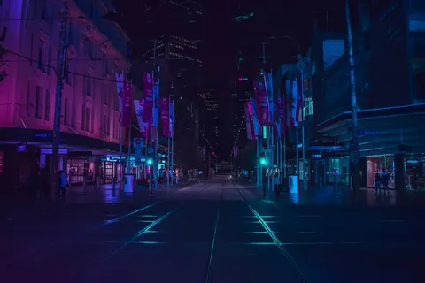 A city street illuminated at night